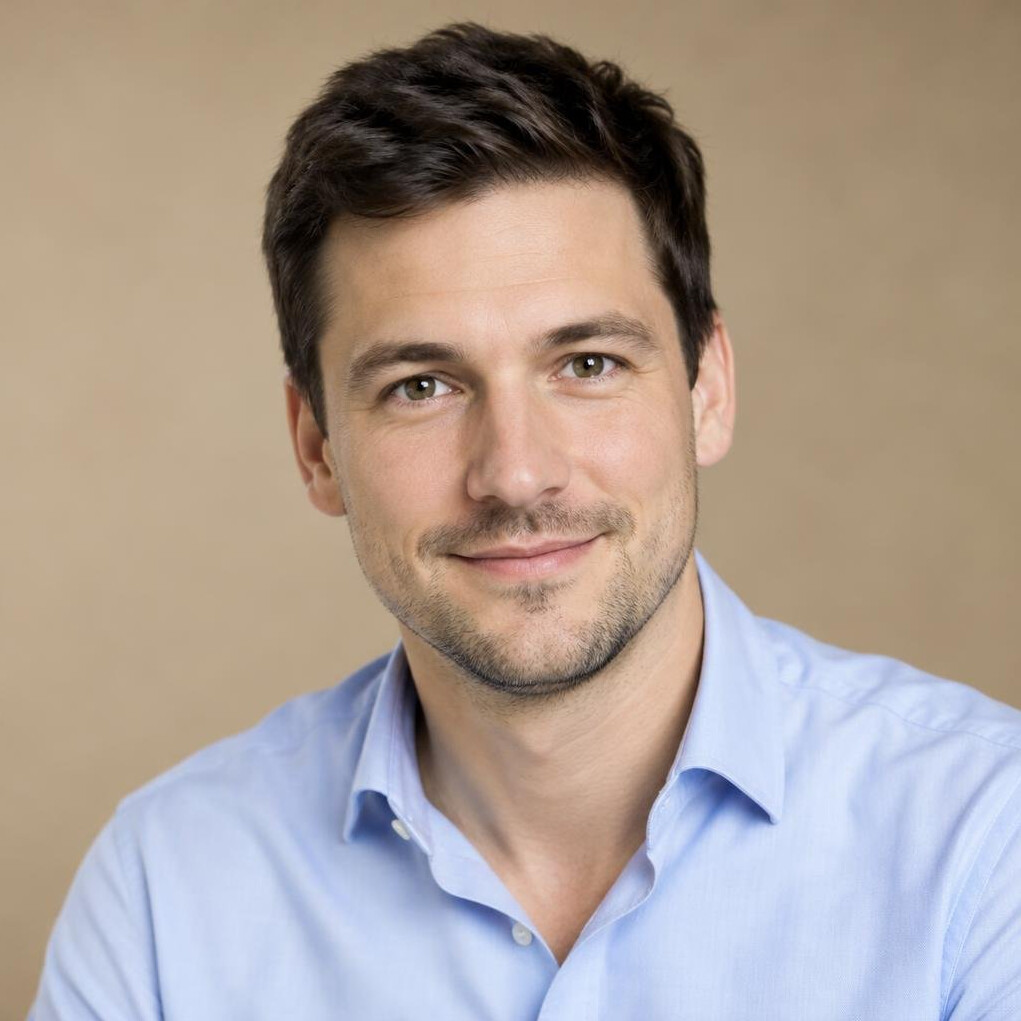 Portrait of a German man in his thirties with short dark hair and a light shirt